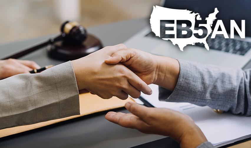 A close-up of a handshake at an EB-5 visa expert's office, with the EB5AN logo on top.