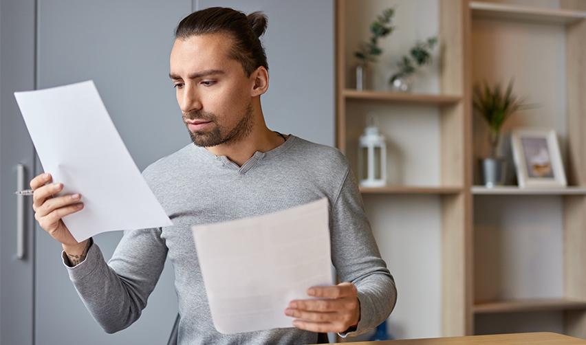 An EB5 investor looking at some visa application documents.