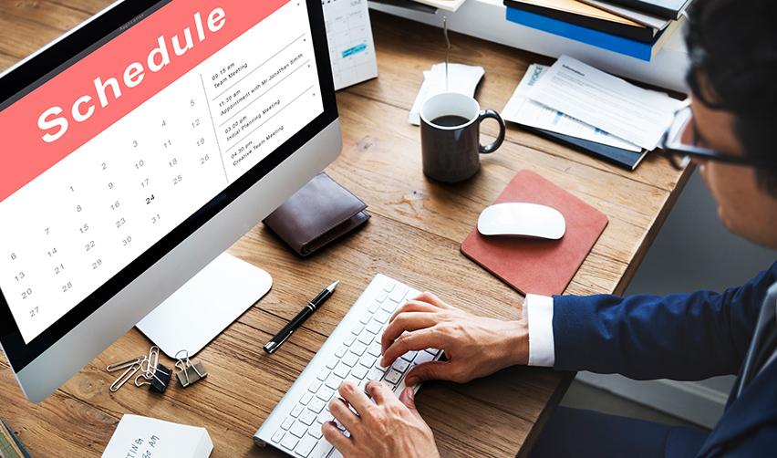 An EB5 investor scheduling a biometrics appointment online with an USCIS office on his computer.