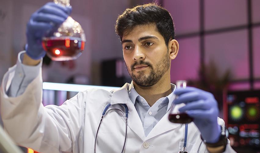 An Indian scientist with extraordinary ability working at a lab for a US employer.