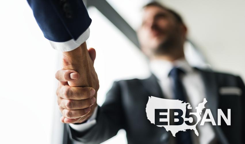 An EB5 investor shaking hands with a regional center principal, with the EB5AN logo on the corner.