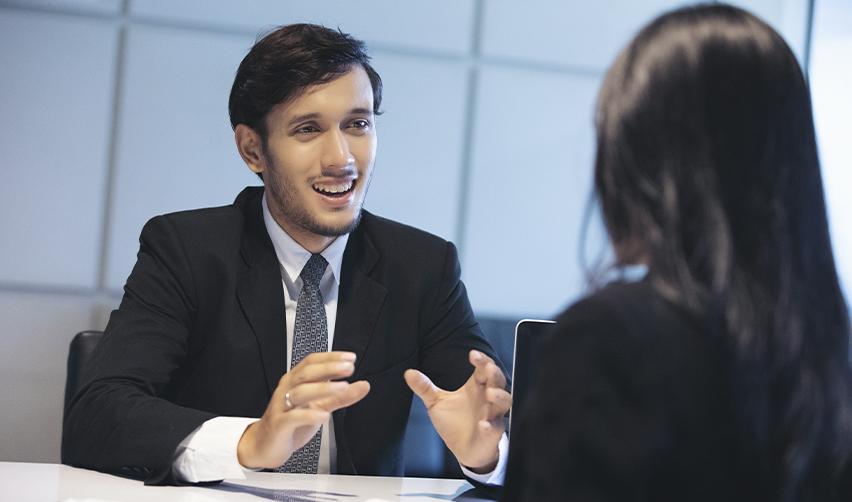 Immigration experts explaining the visa types, required documents and immigrant visa application process to foreign workers.