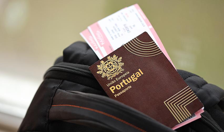 A passport of Portugal with boarding passes between its pages, symbolizing Portugal golden visa.