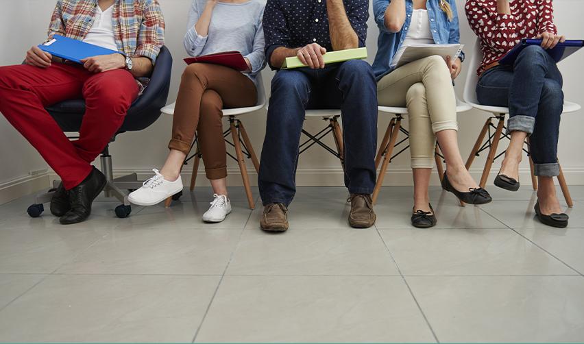 A group of candidates waiting for their interview at an office, symbolizing EB5 job creation.