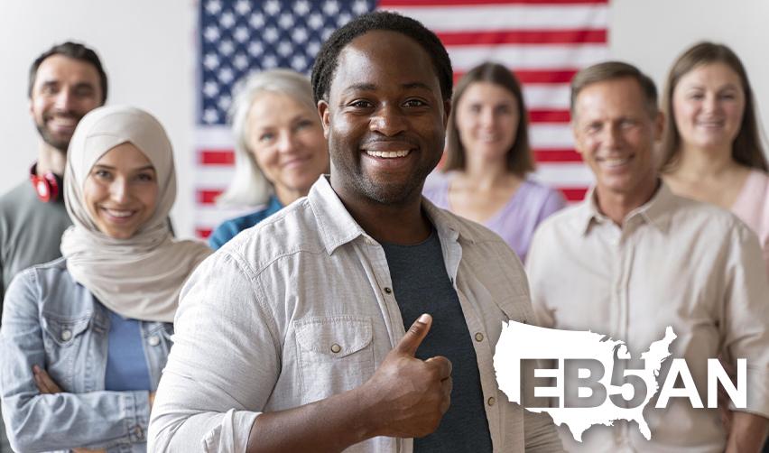 A diverse group of eligible investors smiling at the camera behind the EB5AN logo.