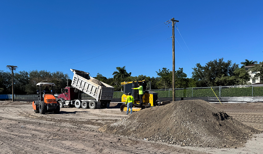 A construction vehicle on a dirt road