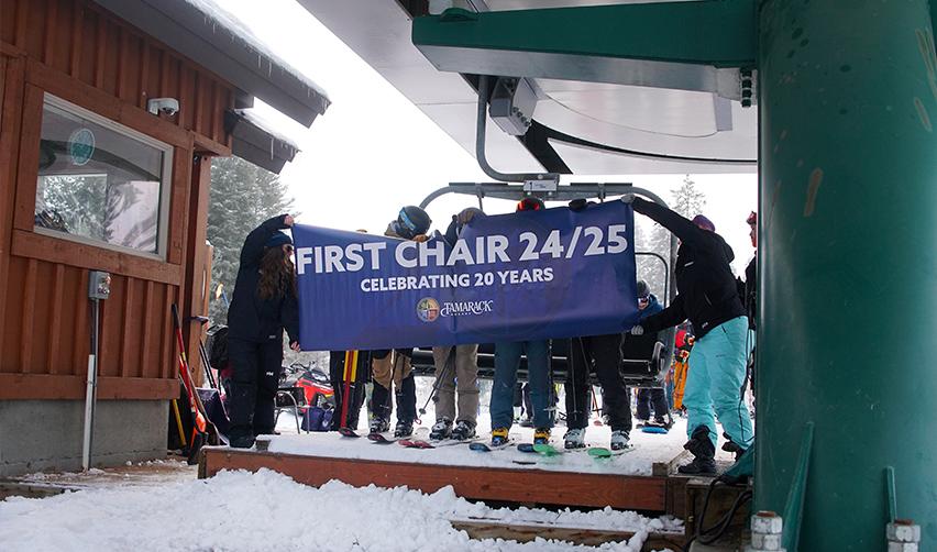 A group of people holding a banner