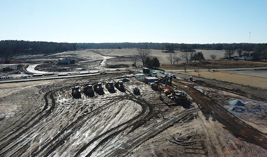 A construction site with lots of vehicles