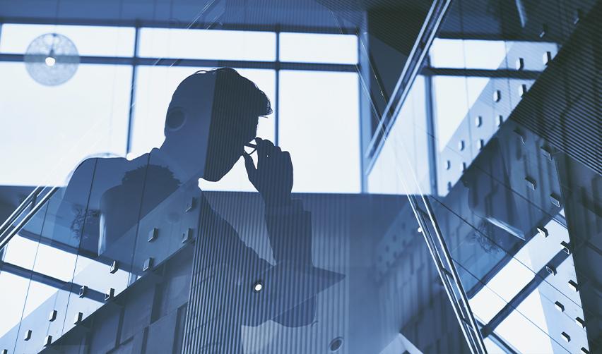 Silhouette of an alien entrepreneur in a glass office, representing strategic planning and decision-making in EB5 investment opportunities.