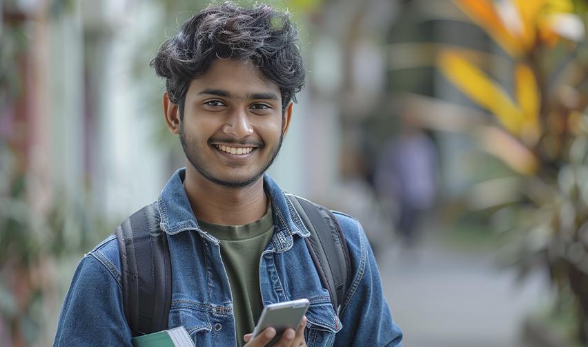 Smiling Indian student, representing the benefits of the EB5 visa for education and permanent residency in America.