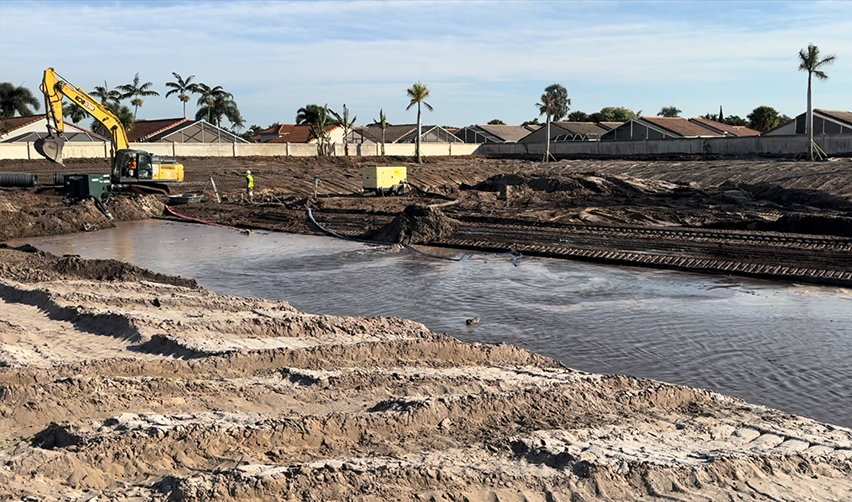 A construction site with a body of water
