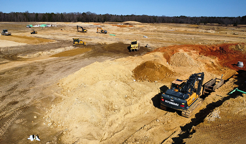 A construction site with several excavators