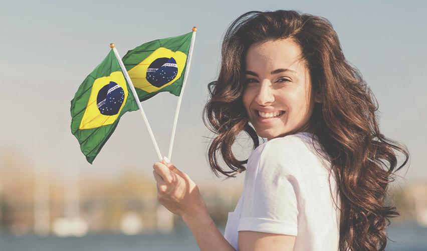 A joyful woman waving Brazilian flags, celebrating her new life as a US Green Card holder, with dreams of one day becoming a U.S. citizen.