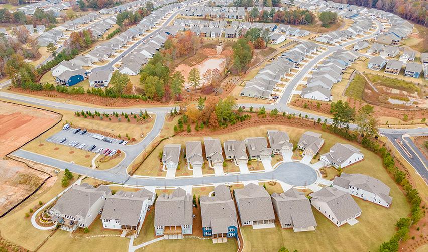 Drone image of the residential development at Twin Lakes by Kolter and EB5AN, showing rows of modern homes in a thoughtfully planned, landscaped active adult community.