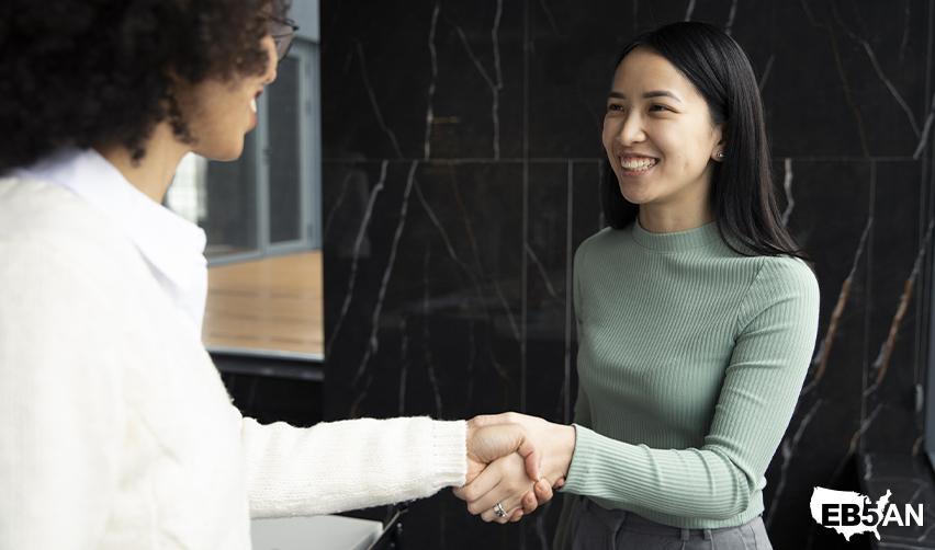 An EB5 investor meeting with an immigration advisor or EB5AN regional center representative to prepare a stronger application.