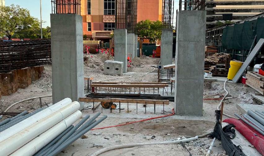 A construction site with several pillars