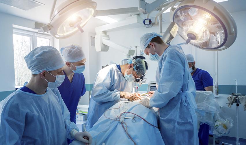 Medical professionals conducting a surgery in a hospital setting, symbolizing EB-2 visa applicants with advanced degrees in healthcare fields.