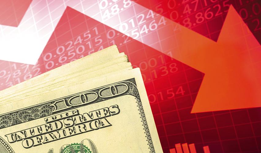 A stack of U.S. hundred-dollar bills in front of a red downward arrow and currency rate chart, symbolizing inflation and economic instability around the world.