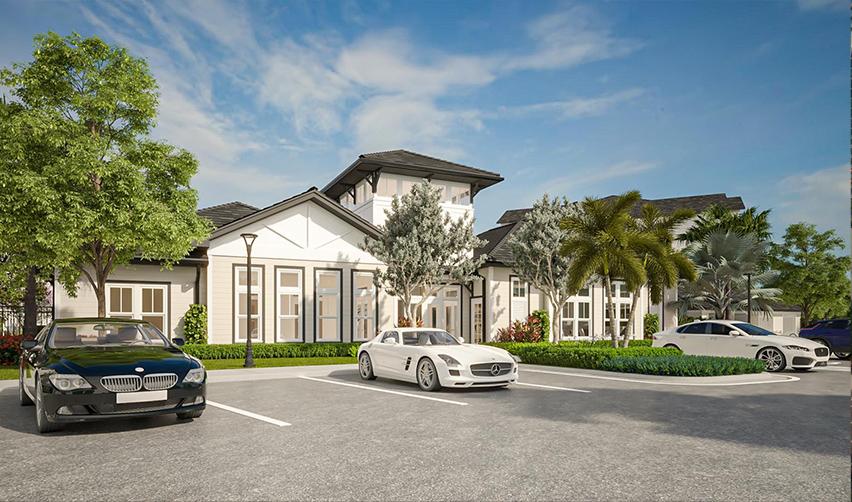 A white building with cars parked in front of it