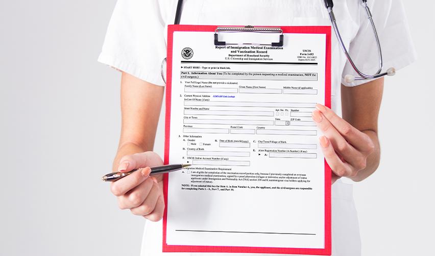 Close-up of a USCIS Form I-693, Report of Immigration Medical Examination and Vaccination Record, used in the EB5 Green Card process.