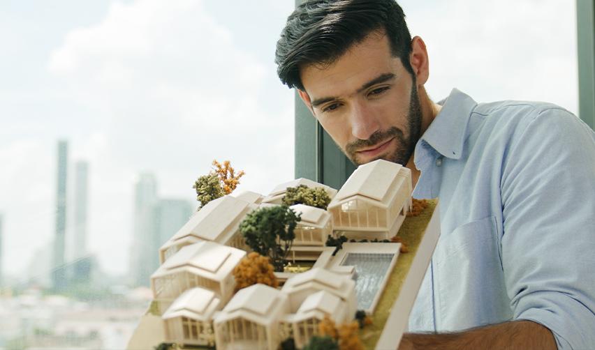 An investor analyzing a rural development model, symbolizing EB5 rural TEA project or new commercial enterprise evaluation under priority processing benefits.