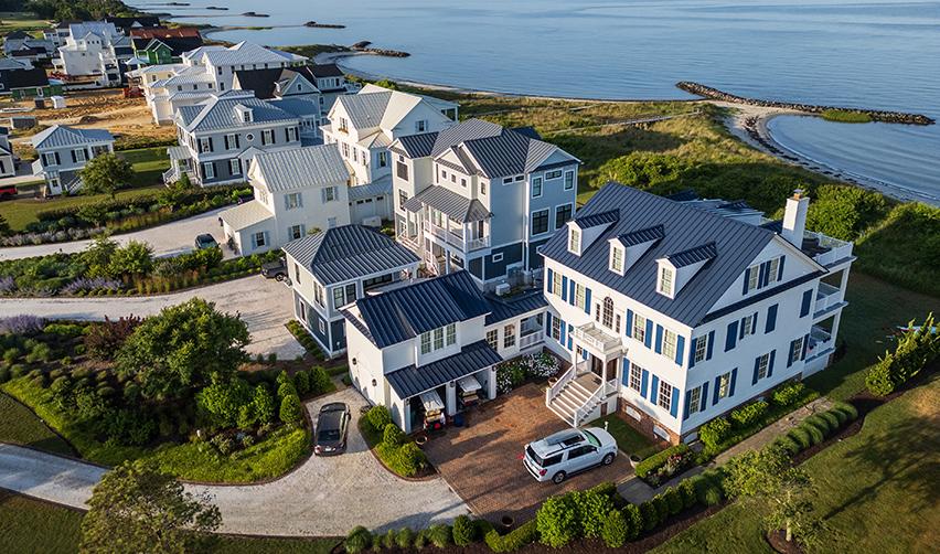Aerial view of coastal homes in Bay Creek, Virginia, overlooking the Chesapeake Bay, highlighting the community's scenic residential setting and shoreline access.