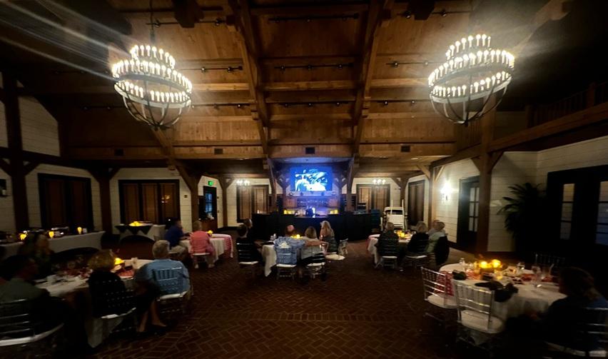 Bay Creek residents seated for a movie screening and Italian buffet at Chesapeake Hall during the July 25 Dinner & a Movie night featuring Roman Holiday.