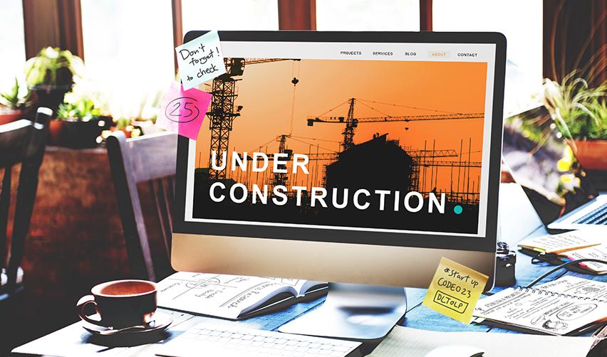 A desktop screen showing an “Under Construction” webpage with cranes in the background, symbolizing EB5 project construction updates shared with investors.