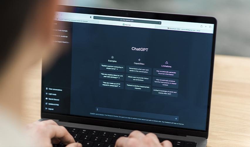 A person using ChatGPT on a laptop, illustrating how EB5 investors can use AI tools to research and evaluate immigration attorneys efficiently.