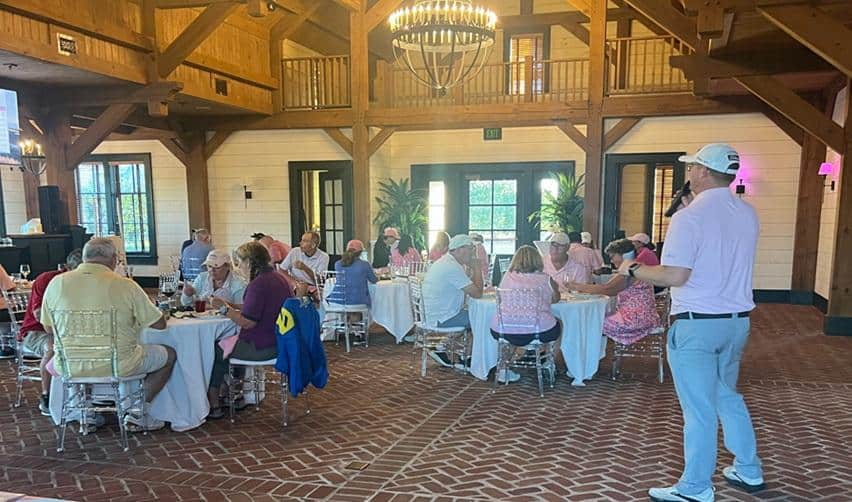 Bay Creek members gathered inside the Coach House Tavern during an October community event, reflecting the friendly, connected lifestyle that defines this EB5 residential community.