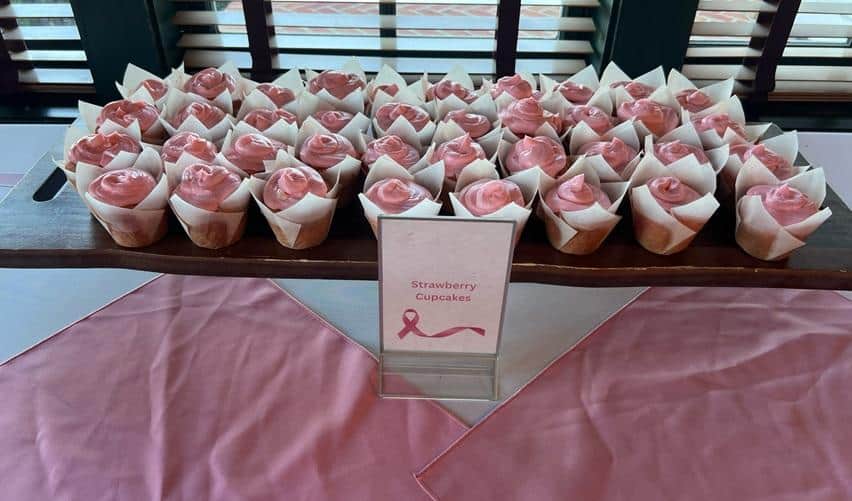 Display of pink strawberry cupcakes served during Bay Creek’s Hearts and Hope month, part of the community’s Breast Cancer Awareness Month activities.
