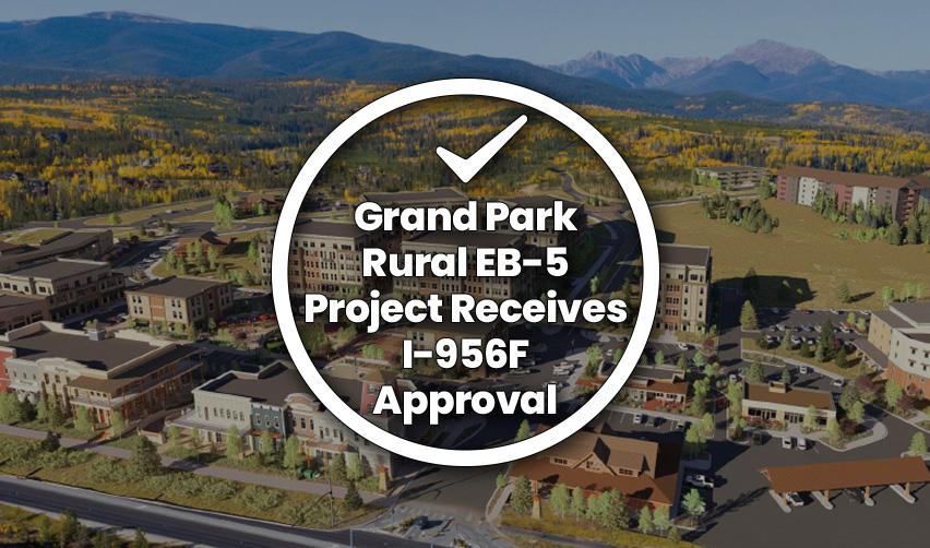 Aerial rendering of Grand Park, a master-planned community in Fraser, Colorado, surrounded by mountains and fall foliage, representing the Grand Park rural EB5 project receiving I-956F approval.