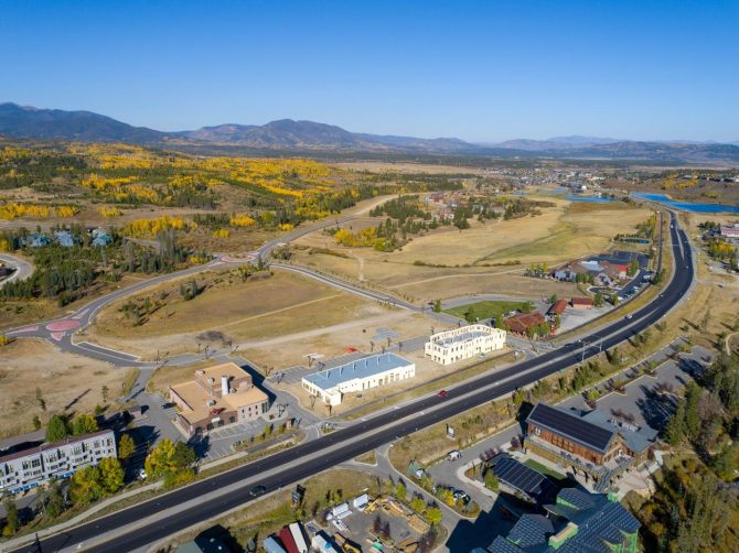 A road with buildings and a road in the middle