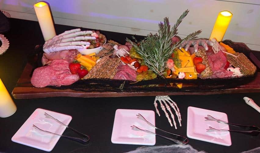 Halloween-themed charcuterie display at Bay Creek’s Costume Cocktail Party, featuring festive décor and seasonal treats.