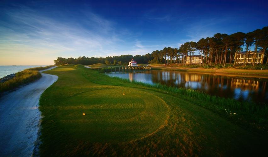 Scenic golf course view at Bay Creek overlooking water and rolling fairways, showcasing the community’s outdoor amenities.