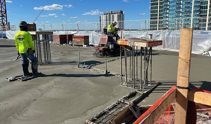 Concrete slab pour underway at the upper levels of ONE Tampa, showing active vertical construction progress on the EB5 residential tower.