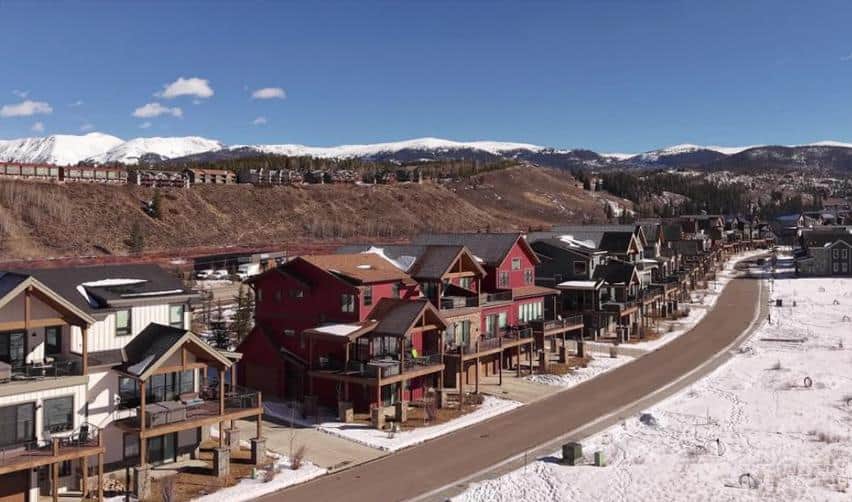 Elevated view of completed and near-completed homes at Grand Park along newly built roads, demonstrating steady progress in this rural EB5 community.