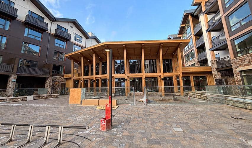 Front-facing view of Kindred Resort at Keystone’s main lodge building, showcasing timber architecture and nearly finished exterior as construction wraps up on the EB5 project.