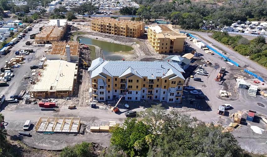 Terra Ceia Multifamily vertical construction advancing with completed roofing and exterior wrap visible on EB5 project structures.