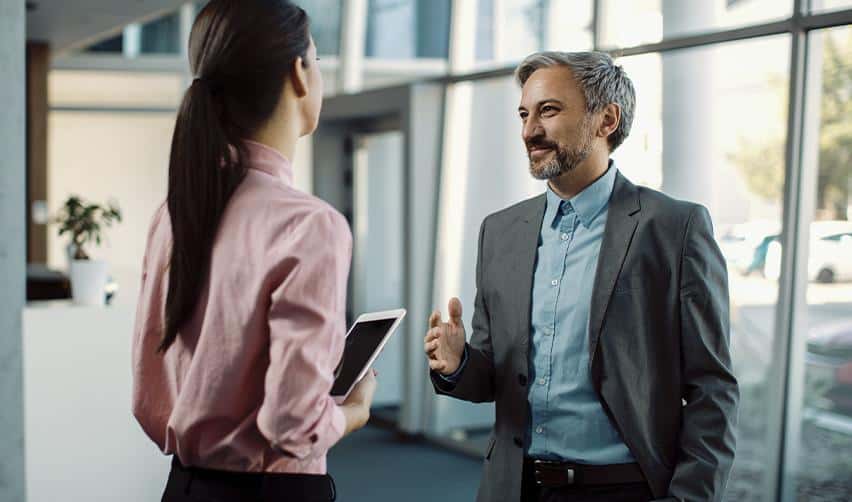 An EB5 investor discussing project timelines and return of capital expectations with a regional center representative during a professional consultation.