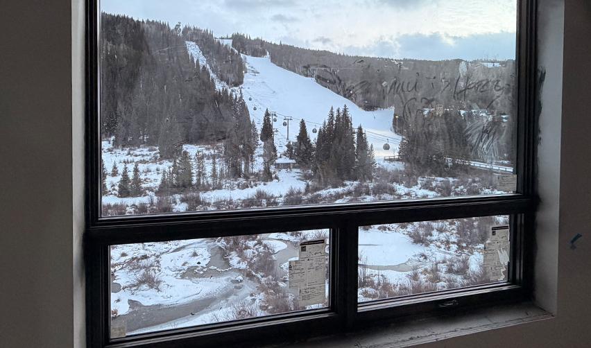 View from inside Kindred Resort at Keystone overlooking ski slopes and gondola lines, emphasizing direct lift access that supports the project’s positioning as a premier rural EB5 resort.