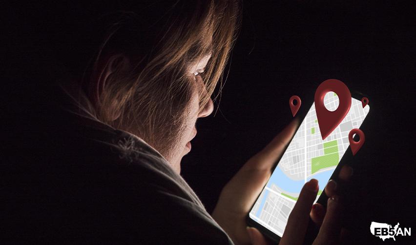 AN EB5 investor looking at a map on a smartphone screen, researching best EB5 projects in VA.